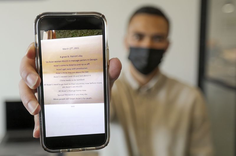 Dustin Watkins, DataBased co-founder, shows a copy of a
hate letter that his brother’s Asian employee received, at Kiln, a
co-working space where Watkins has an office, in Lehi on Tuesday,
March 30, 2021. Watkins, who is Filipino, has heard of multiple
Asian people in Utah receiving hate letters recently.