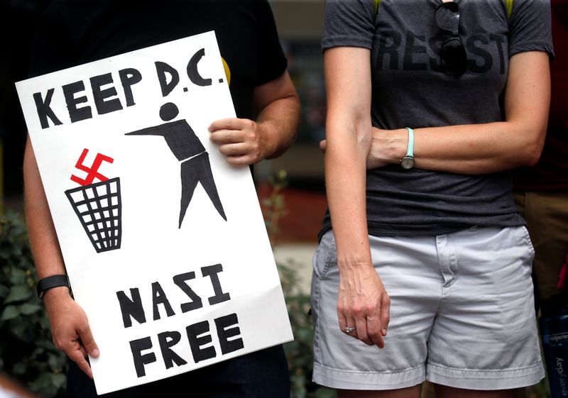 People gather at Freedom Plaza to protest the white nationalist Unite the Right rally held in front of the White House on the one-year anniversary of the white nationalist rally in Charlottesville, VA, in downtown Washington, U.S., August 12, 2018. REUTERS/ Leah Millis