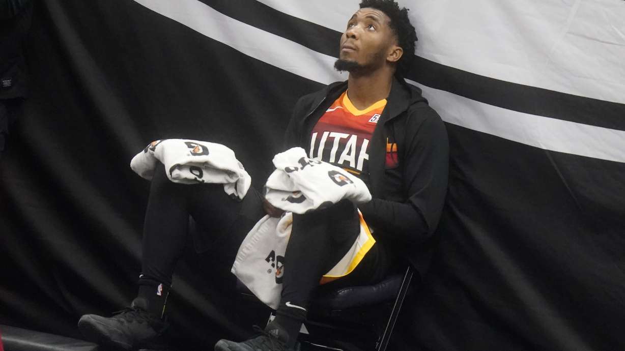 Utah Jazz guard Donovan Mitchell (45) looks on from the bench in the second half during an NBA basketball game against the Cleveland Cavaliers, Monday, March 29, 2021, in Salt Lake City. (AP Photo/Rick Bowmer)