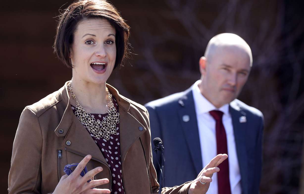 State epidemiologist Dr. Angela Dunn speaks during the weekly COVID-19 briefing outside of Northrop Grumman's offices in Roy on Thursday, April 1, 2021, as Gov. Spencer Cox looks on.