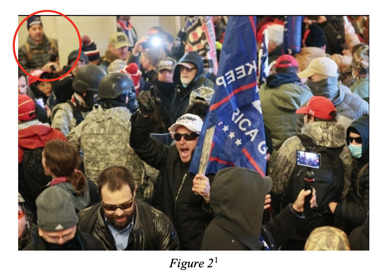 In a screenshot from Michael Hardin’s federal complaint, a photo posted online by TMZ and sent to the FBI by a tipster shows a man the tipster says is Hardin, circled in red, in a crowd of people inside the Capitol Crypt in Washington on Jan. 6, 2021.