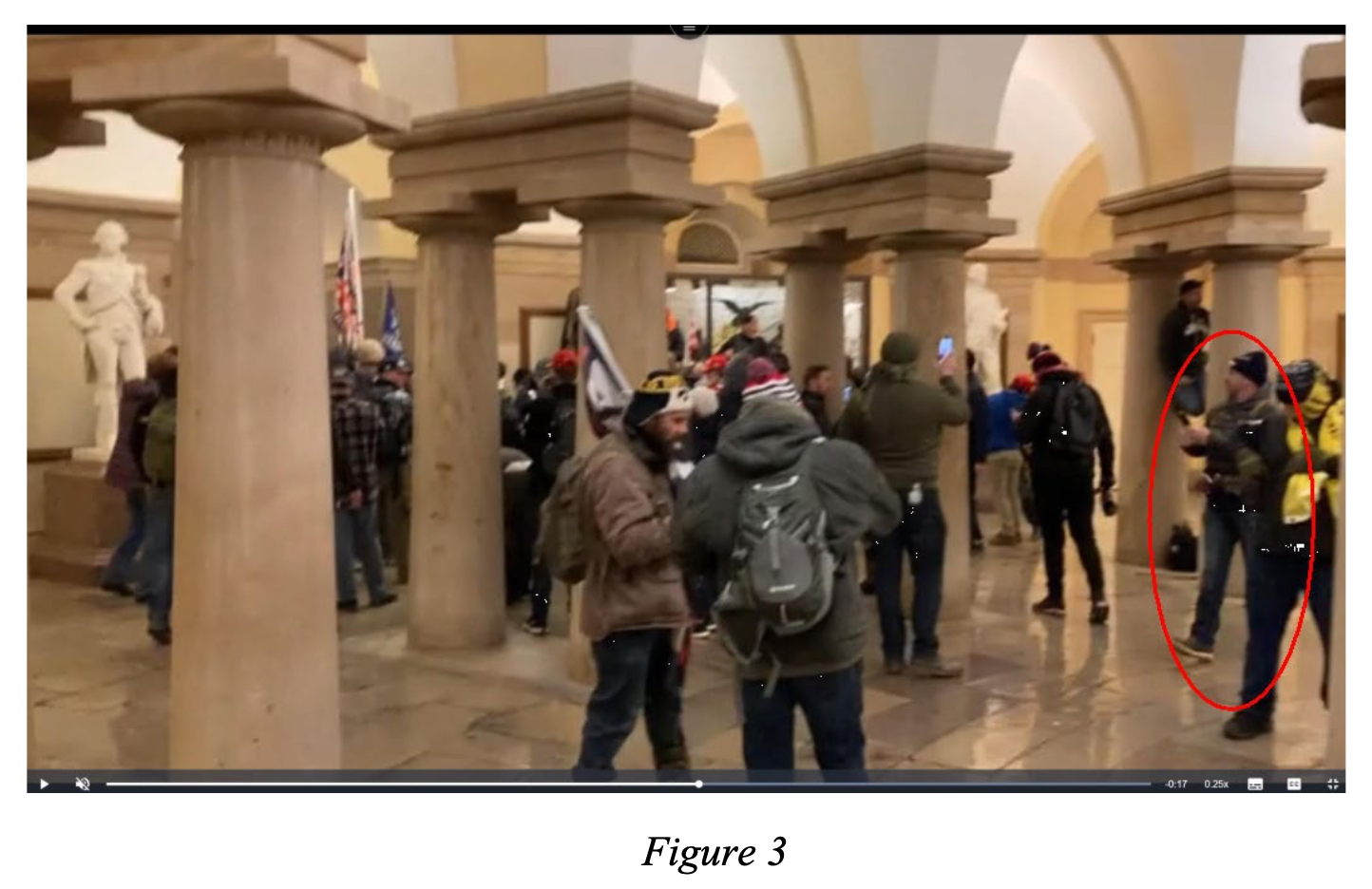 An image of a video obtained by the FBI shows a man investigators say is Michael Lee Hardin, circled in red, in a crowd of people inside the Capitol Crypt in Washington on Jan. 6, 2021. Hardin pleaded guilty Friday to participating in the riot.