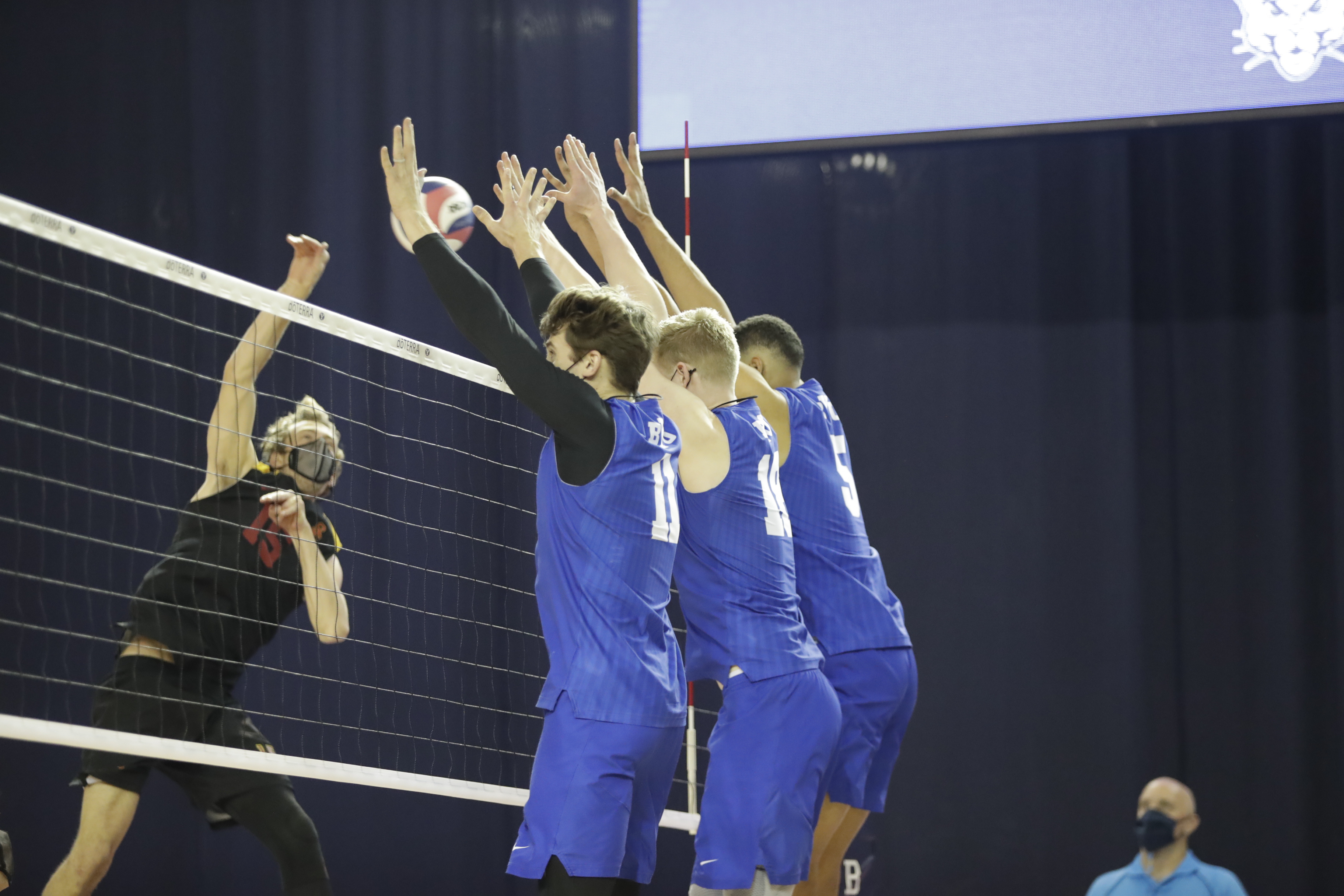 BYU senior Zach Eschenberg (11) anchors a three-man block during a match against USC, Friday, April 3, 2021 in Provo.