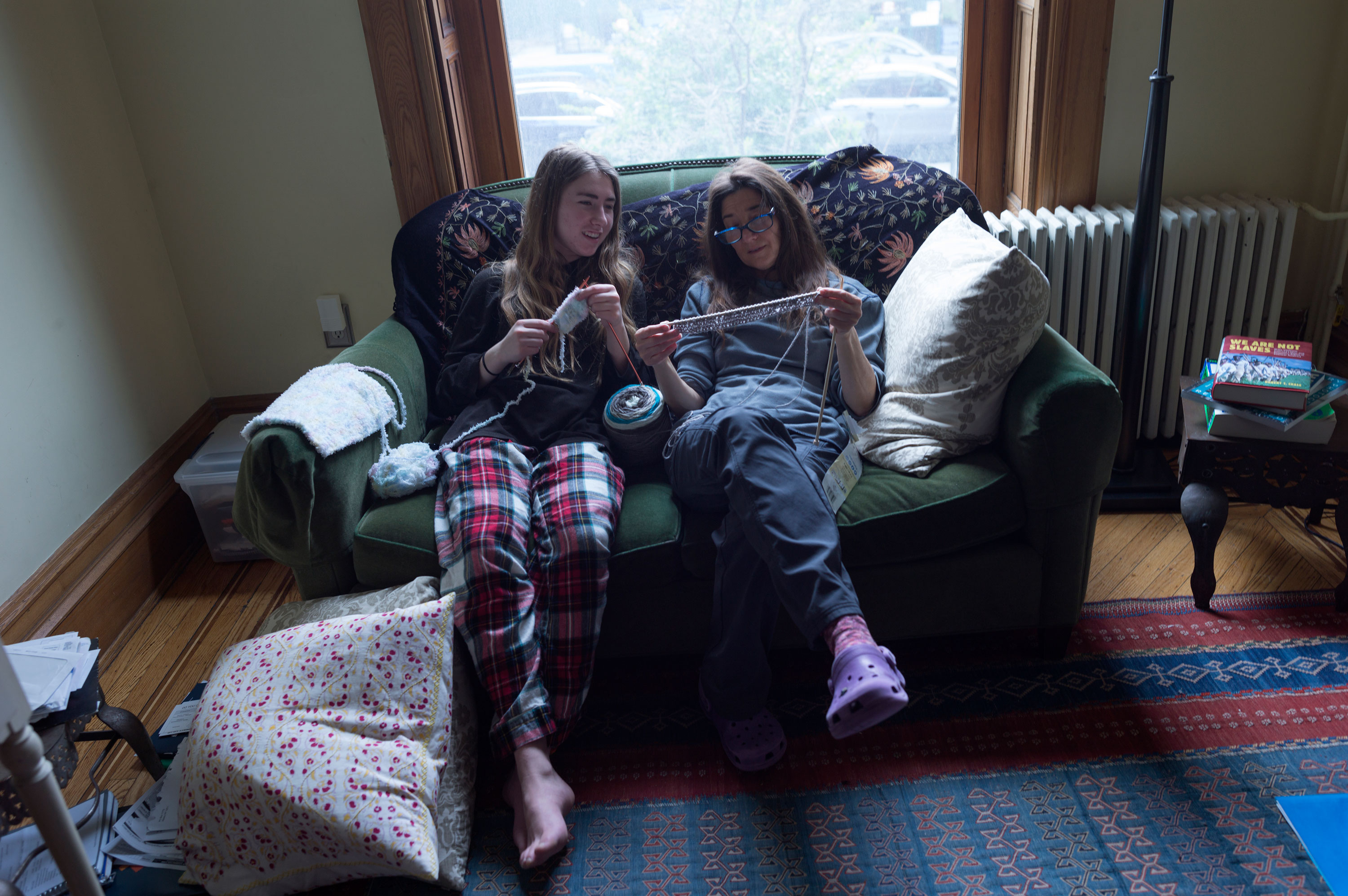 BROOKLYN, NEW YORK - MARCH 22: A mother and daughter learn how to knot together while staying at home under a statewide lockdown to prevent the spread of the COVID-19 virus, March 22, 2020 in Brooklyn, New York. Parents across America, forced to stay at home with their children, are spending much more time with them.
