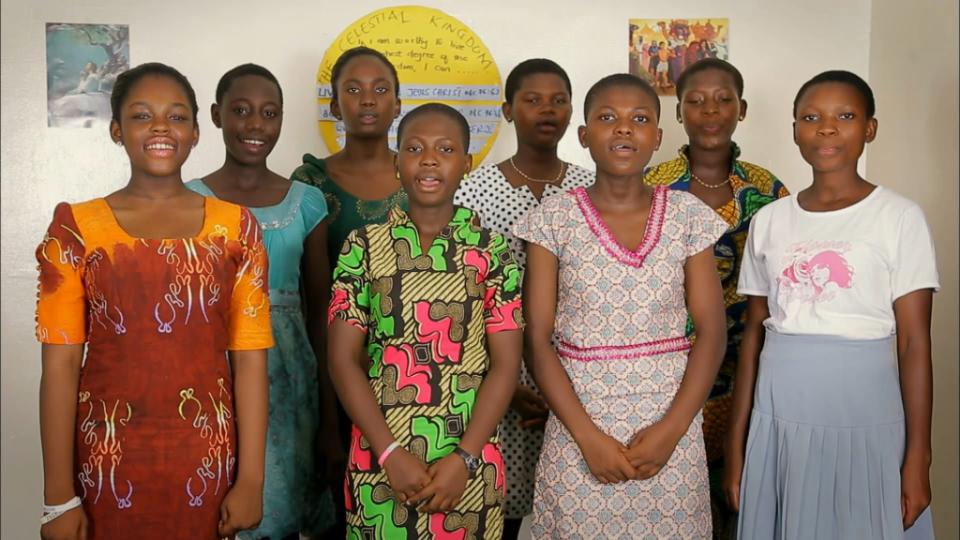 A group of Young women in an International choir sings "I Am a Child of God" during the Sunday morning session, April 4, 2021.