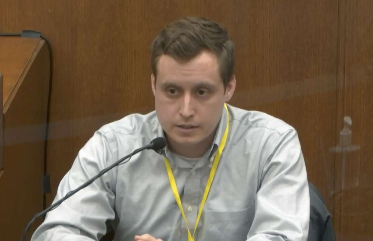 In this image from video, witness Dr. Bradford Wankhede Langenfeld, the doctor who pronounced George Floyd dead, testifies as Hennepin County Judge Peter Cahill presides Monday, April 5, 2021, in the trial of former Minneapolis police Officer Derek Chauvin at the Hennepin County Courthouse in Minneapolis.