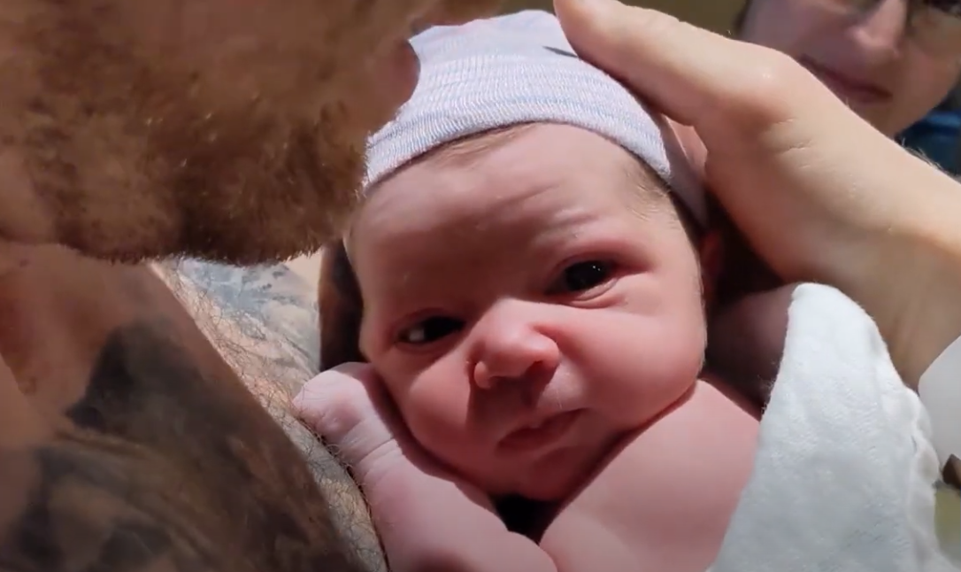 James Lowe holding Hope Lowe while Jen Lowe watches, right after Hope was born.