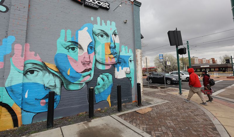 Pedestrians walk along North Temple in Salt Lake City
on Tuesday, April 6, 2021. Salt Lake City Mayor Erin Mendenhall
spoke during a press conference on her vision for providing
community resources and increased safety in the area.