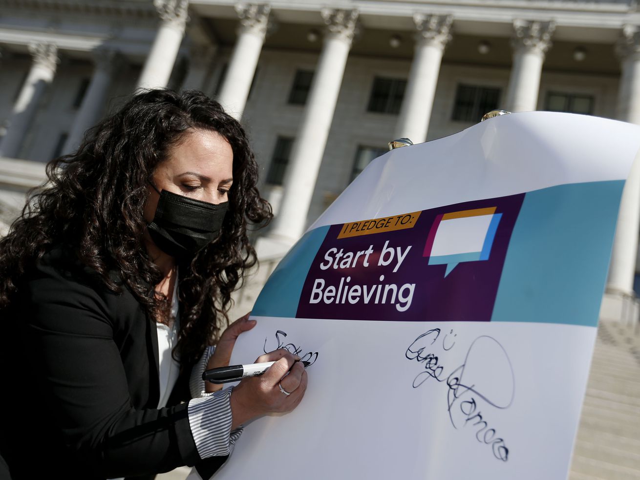 Sonya Martinez-Ortiz, Executive Director, Rape Recovery
Center, signs a Start by Believing pledge to kick off Sexual
Assault Awareness Month at the Capitol in Salt Lake City on
Wednesday, April 7, 2021.