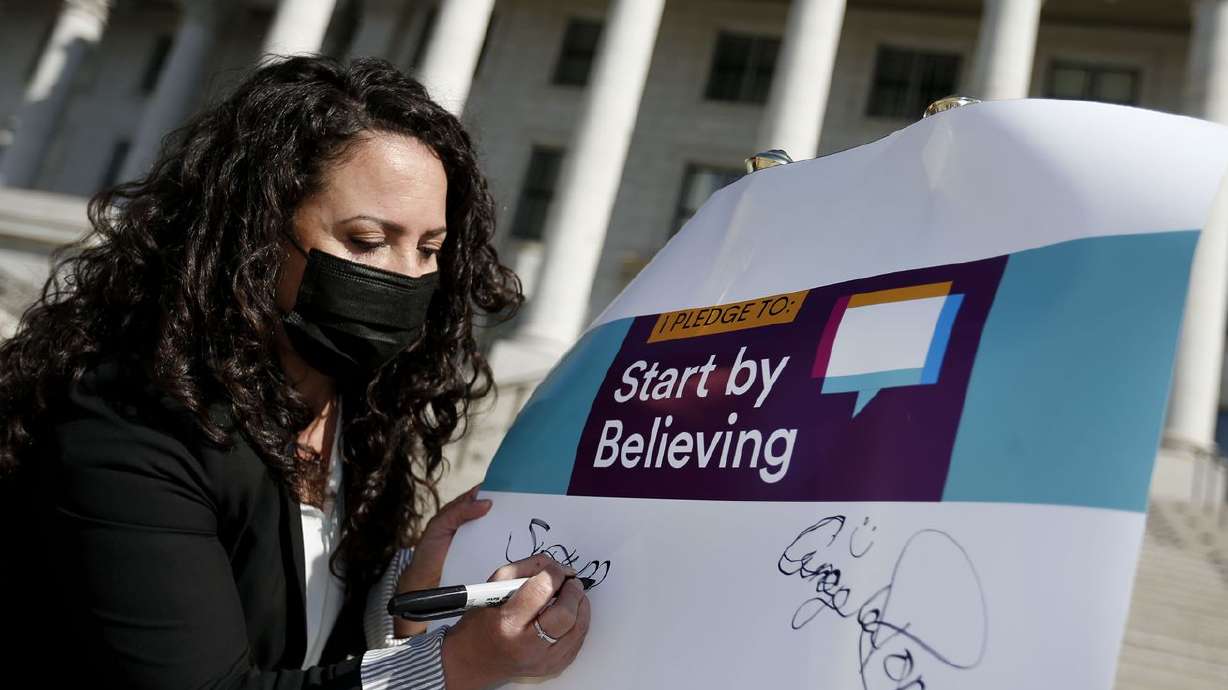 Sonya Martinez-Ortiz, Executive Director, Rape Recovery
Center, signs a Start by Believing pledge to kick off Sexual
Assault Awareness Month at the Capitol in Salt Lake City on
Wednesday, April 7, 2021.