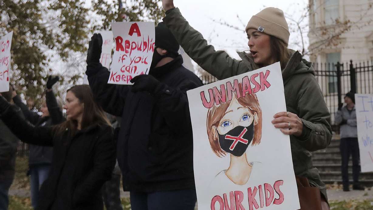 Protesters gather outside of the Governor’s Mansion in
Salt Lake City on Monday, Nov. 9, 2020, to protest Gov. Gary
Herbert’s mask mandate and new COVID-19 restrictions.