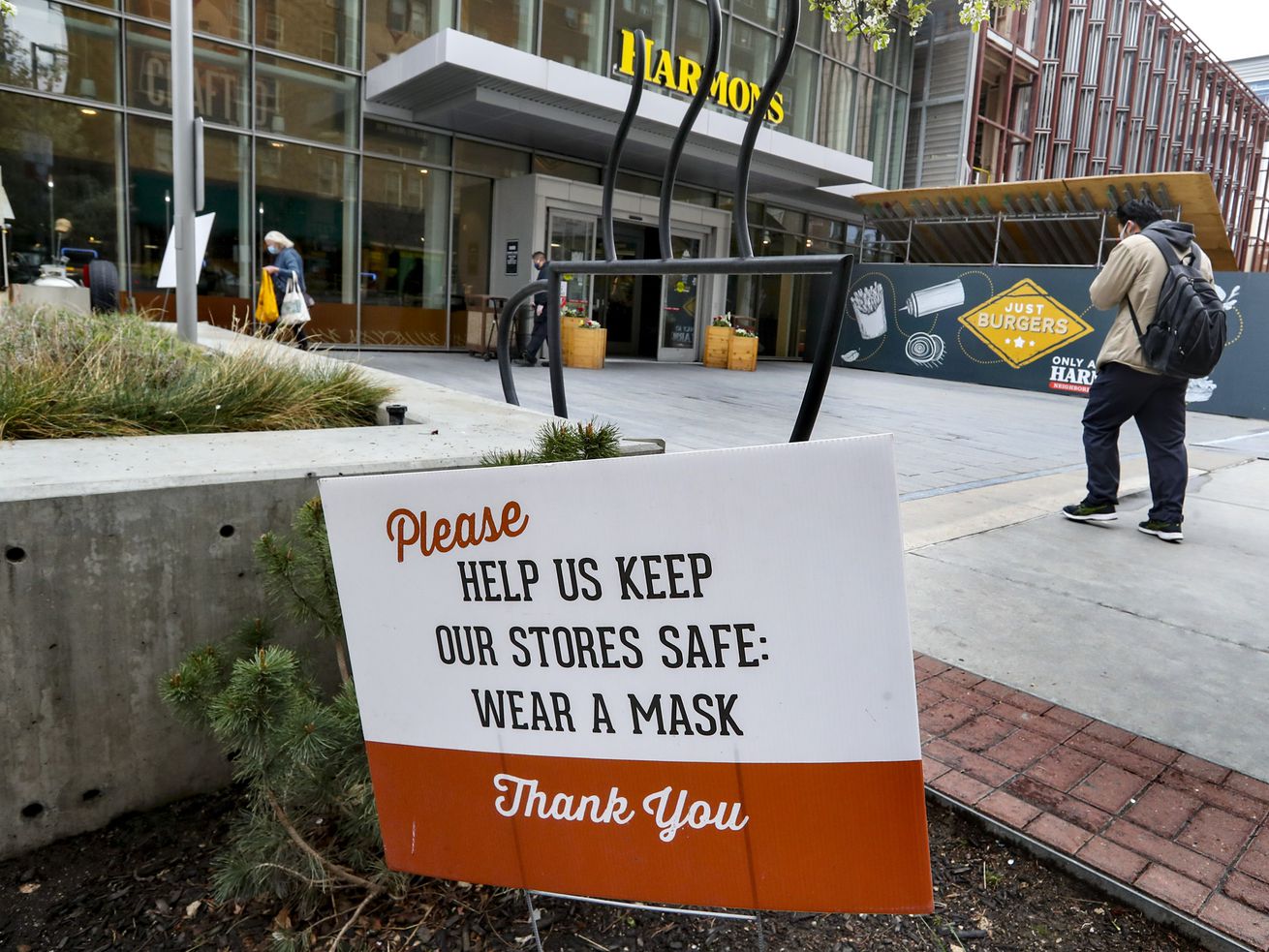 Signs remind customers to wear a mask while shopping at
the Harmons grocery store in downtown Salt Lake City on Tuesday,
April 6, 2021.