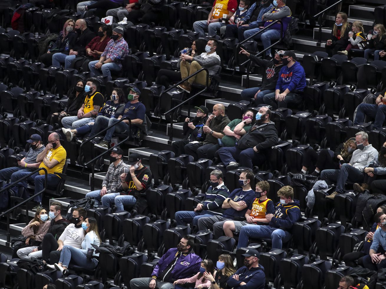 Fans social distance as they watch the New York Knicks
and Utah Jazz NBA basketball game at Vivint Smart Home Arena in
Salt Lake City on Tuesday, Jan. 26, 2021.