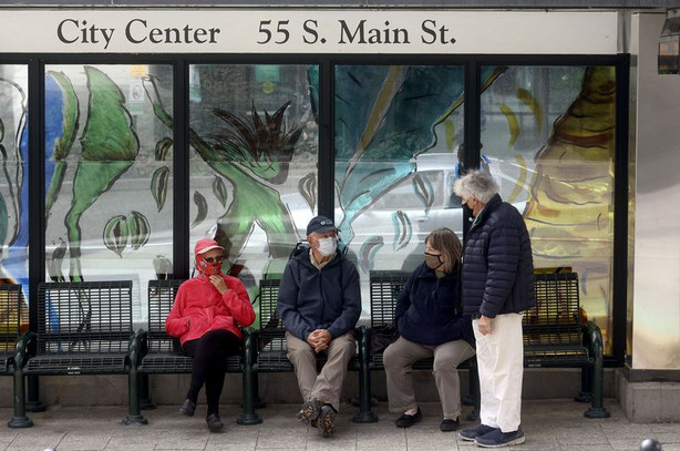 Judy Hamblin, left, Ron Hamblin, Barbara Mason and
Brian Mason wear masks while waiting for TRAX in downtown Salt Lake
City on Wednesday, March 24, 2021.