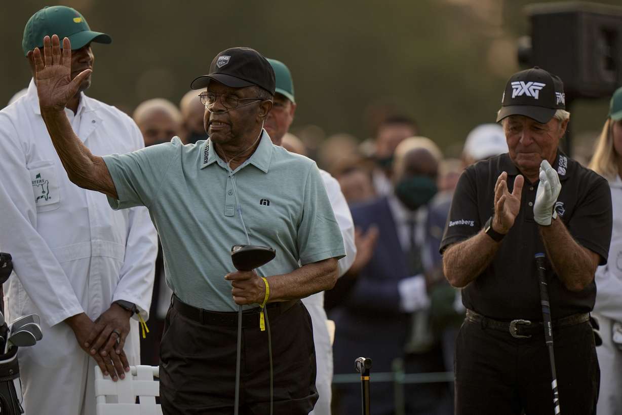 Lee Elder waves with Gary Player before the ceremonial first tee the first round of the Masters golf tournament on Thursday, April 8, 2021, in Augusta, Ga.