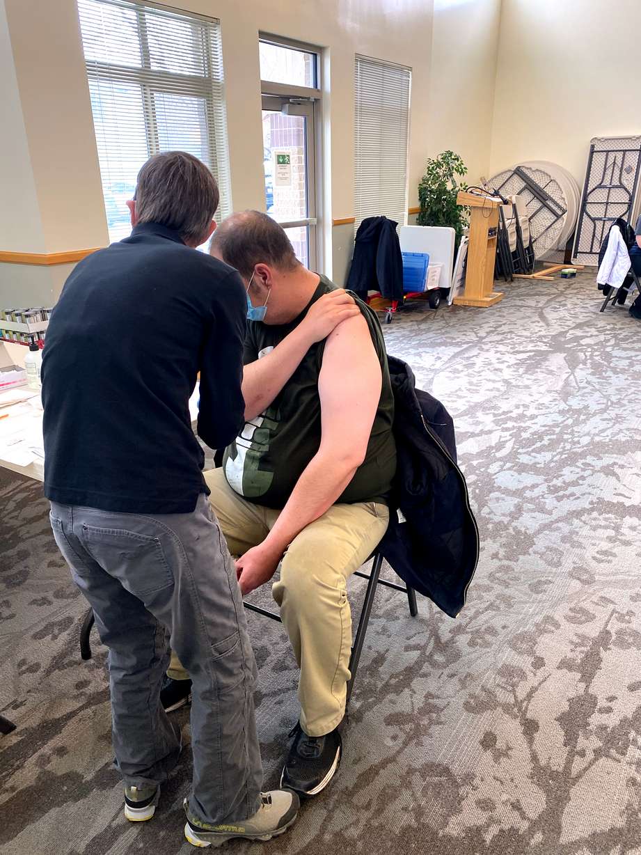 Dr. Berkebile administers the vaccine to a resident of Grace Mary Manor.