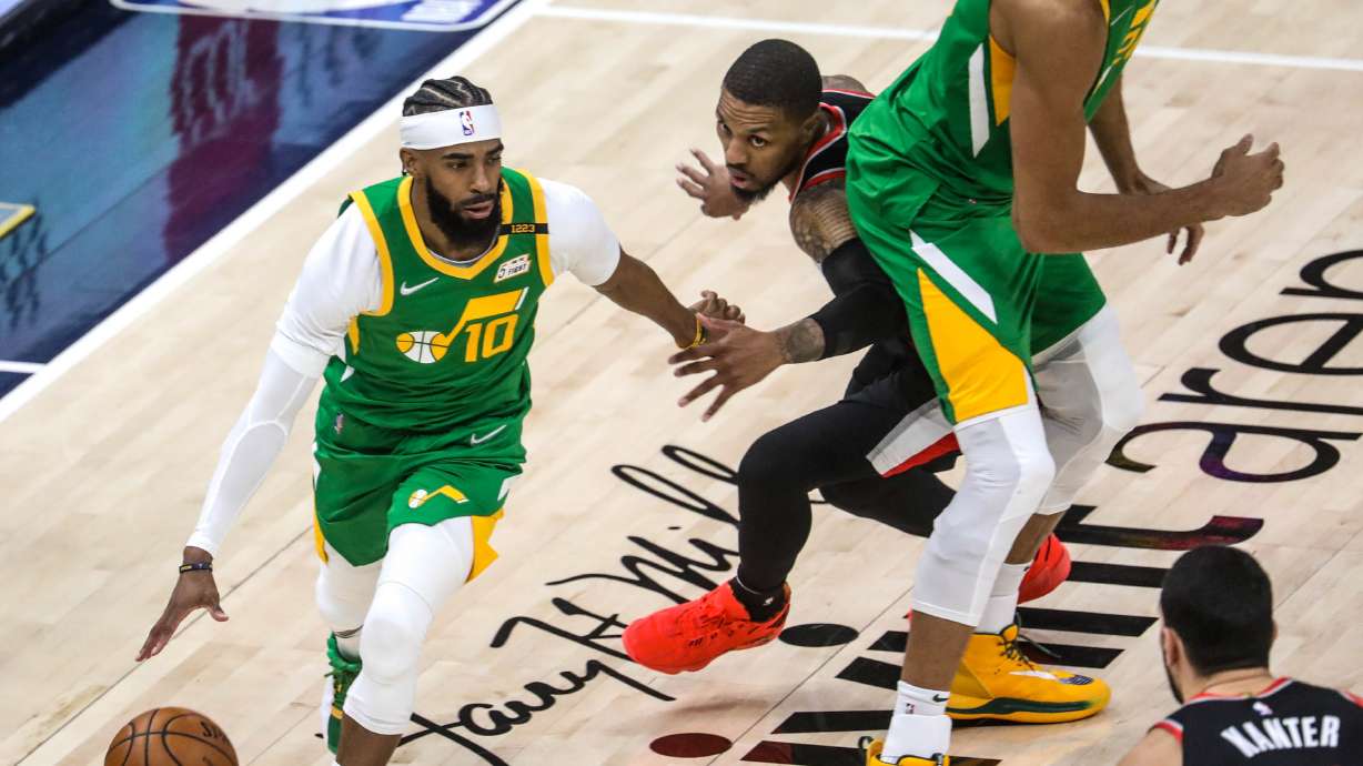 Utah Jazz guard Mike Conley (10) moves with the ball during the game at Vivint Smart Home Arena in Salt Lake City on Thursday, April 8, 2021.