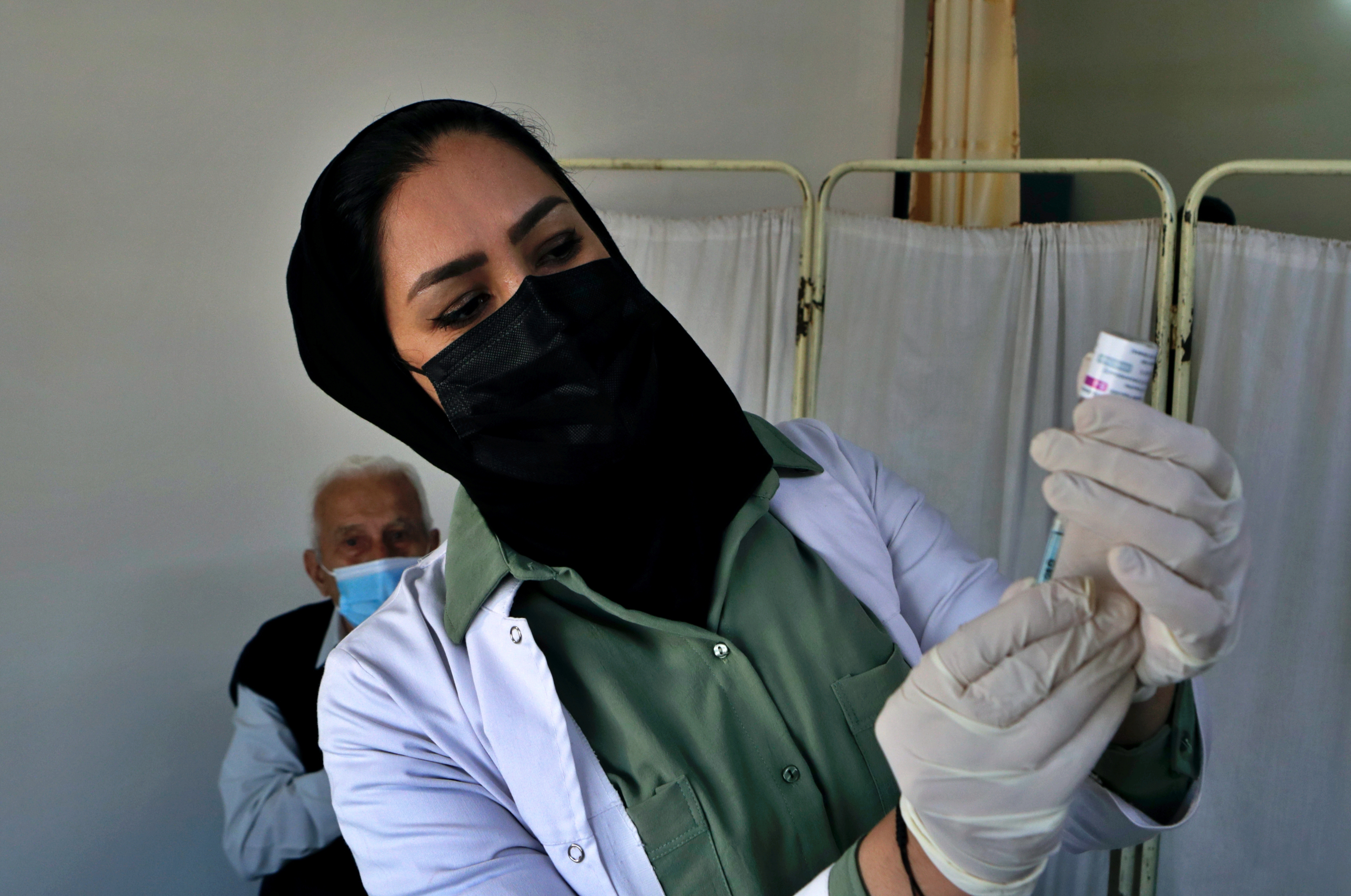 Iraq blames public for new virus record, urges vaccinations