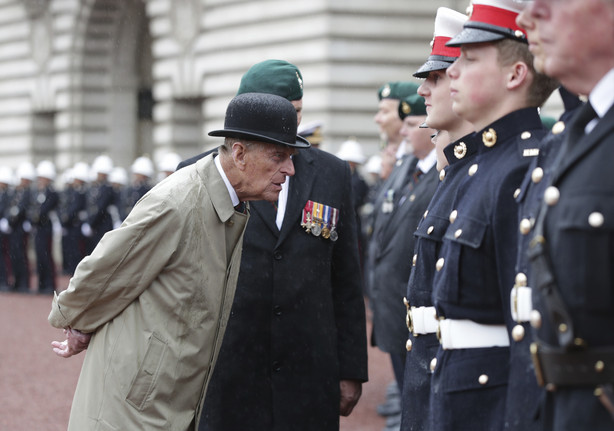 FILE - In this Wednesday Aug. 2, 2017 file photo, Britain's Prince Philip, in his role as Captain General of the Royal Marines, talks to troops as he attends a Parade on the forecourt of Buckingham Palace, in central London.