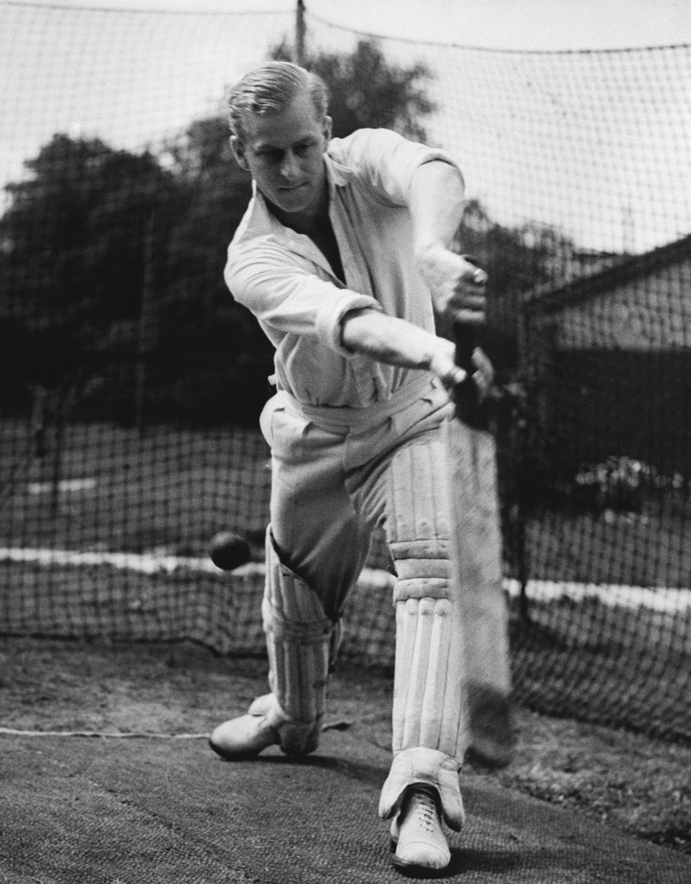 FILE - In this July 31, 1947 file photo, Lt. Philip Mountbatten, whose marriage to Princess Elizabeth has been set for November 20, bats at the nets during cricket practice at the Petty Officers' Training Center, Corsham, England.