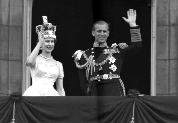 FILE - In this June 2, 1953 file photo, Britain's Queen Elizabeth II and her husband, the Duke of Edinburgh, wave from the balcony of Buckingham Palace, London, following the Queen's coronation at Westminster Abbey.
