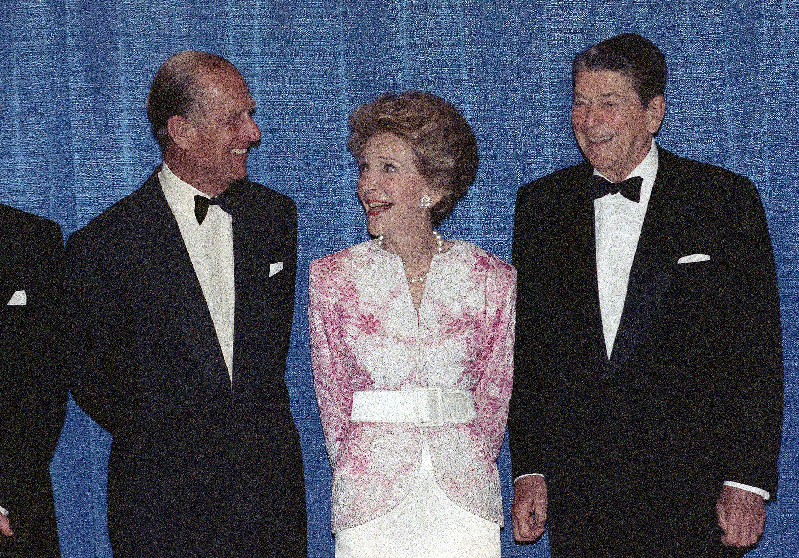 FILE - In this Wednesday, May 17, 1989 file photo, Britain's Prince Philip talks with former US President Ronald Reagan, right, and his wife Nancy Reagan prior to a dinner in Beverly Hills, Calif. The Prince presented the Winston Churchill Award to the former president.