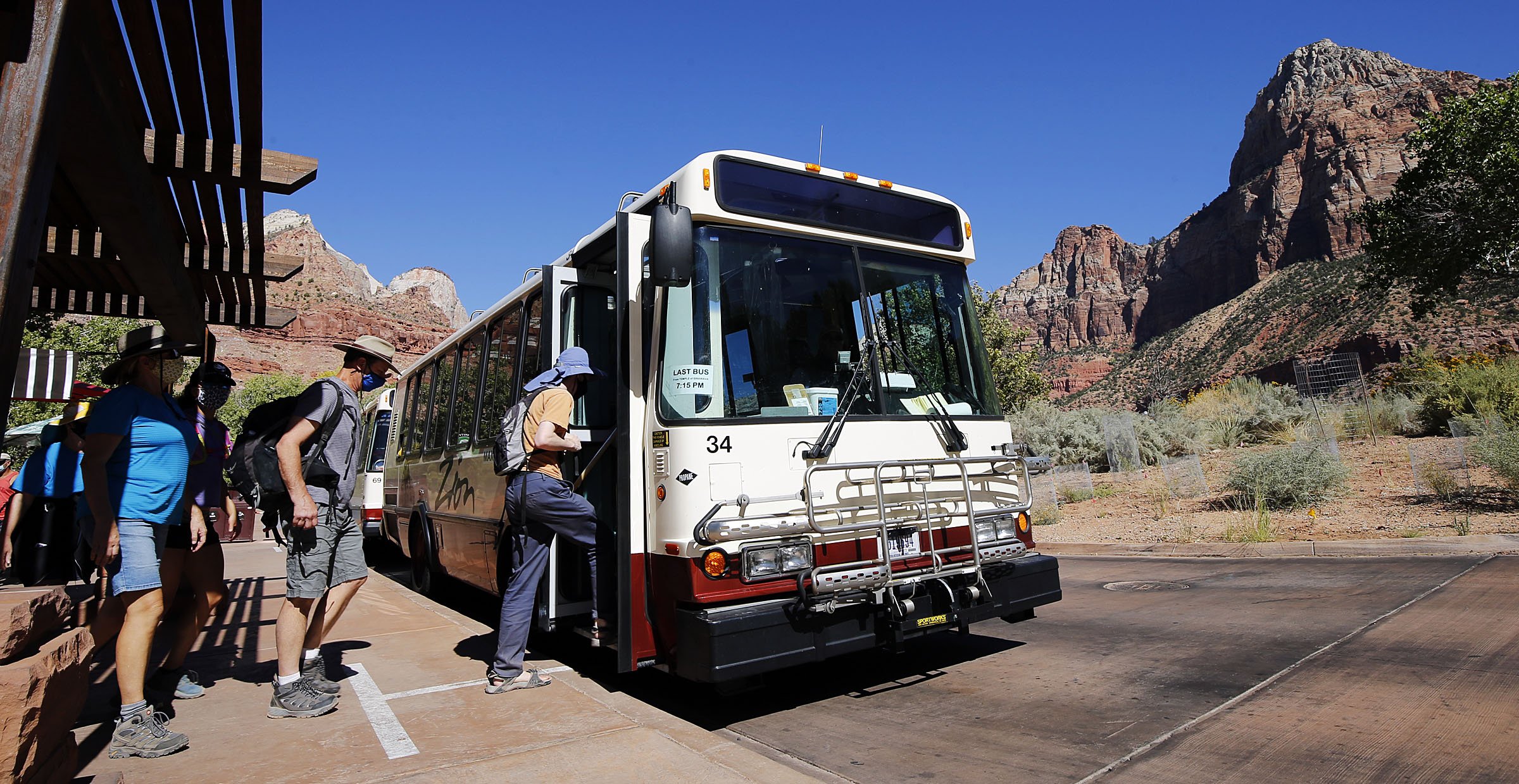 Visitors board a shuttle at Zion National Park on Wednesday, Oct. 14, 2020.