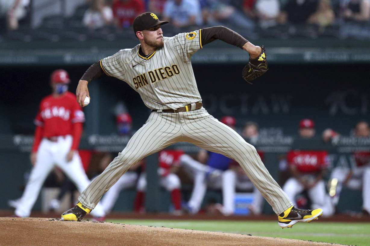 San Diego Padres starting pitcher Joe Musgrove throws to a Texas Rangers batter during the first inning of a baseball game Friday, April 9, 2021, in Arlington, Texas.