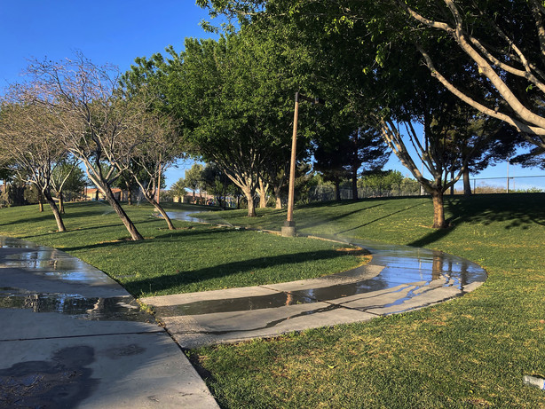 Sprinklers water grass at a park on Friday, April 9, 2021, in the Summerlin neighborhood of Las Vegas. A desert city built on a reputation for excess wants to become a model for restraint with a first-in-the-nation policy limiting water use by banning grass that nobody walks on. Parks would not be included, but Las Vegas area water officials are asking the state Legislature to pass a law banning "non-functional turf" in street medians and common areas of communities and office parks.