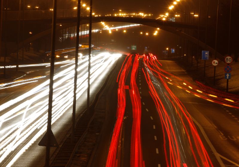 FILE PHOTO: Traffic is seen on Trasa Lazienkowska, one of Warsaw's busiest roads connecting the east and west banks of the Vistula River, during rush hour February 21, 2012. REUTERS/Peter Andrews/File Photo