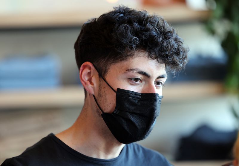 Jack Carrasco, an employee at Stockist, is pictured in the Salt Lake City store on Sunday, April 11, 2021. Stockist owner Helen Wade chose to close the store for the remainder of the day after a person threatened to come back with a gun when asked to leave for not wearing a mask.