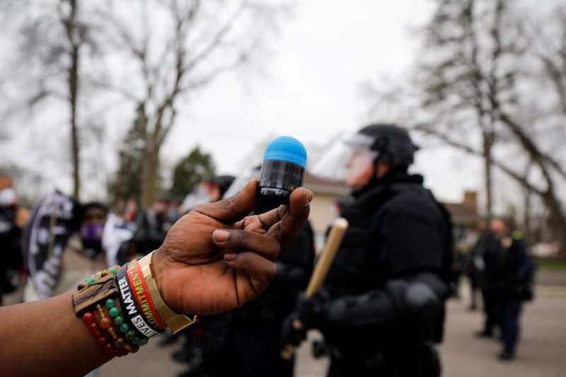 Cortez Rice holds up the rubber bullet that hit him in his side during a confrontation with police after police allegedly shot and killed a man, who local media report is identified by the victim's mother as Daunte Wright, in Brooklyn Center, Minnesota, U.S., April 11, 2021. REUTERS/Nick Pfosi