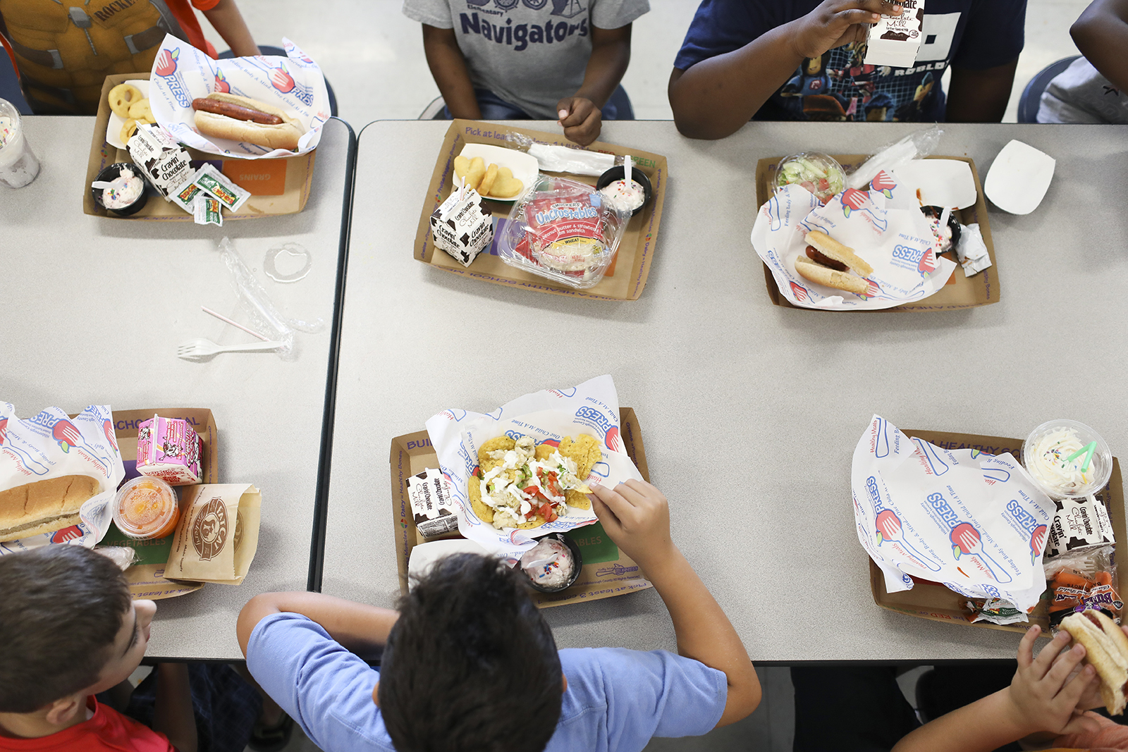 APOLLO BEACH, FL - OCTOBER 4:
Students eat their lunch in the cafeteria at Doby Elementary School in Apollo Beach, Florida on October 4, 2019. In Hillsborough County, students pay $2.25 for lunch.