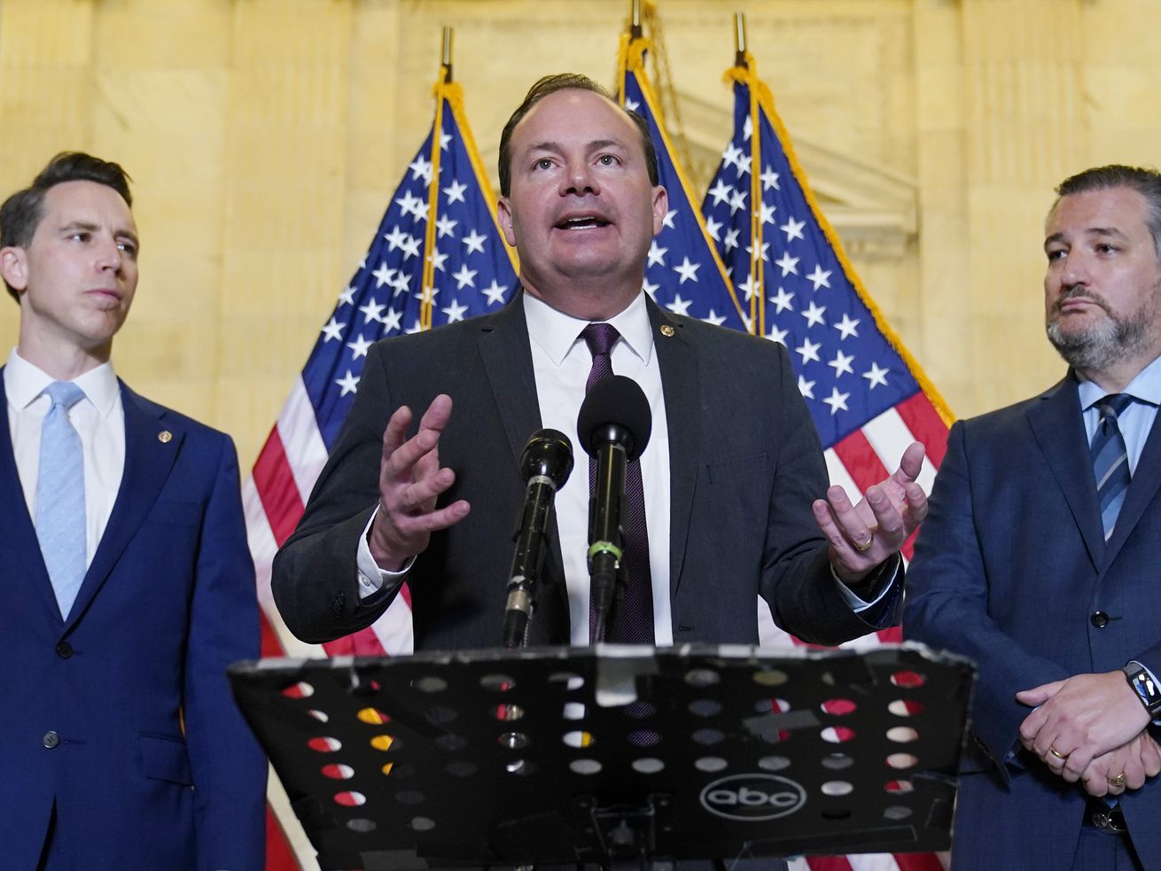 Sen. Mike Lee, R-Utah, center, flanked by Sen. Josh
Hawley, R-Mo., left, and Sen. Ted Cruz, R-Texas, right, talks about
legislation to end Major League Baseball’s special immunity from
antitrust laws, during a news conference on Capitol Hill in
Washington, Tuesday, April 13, 2021.