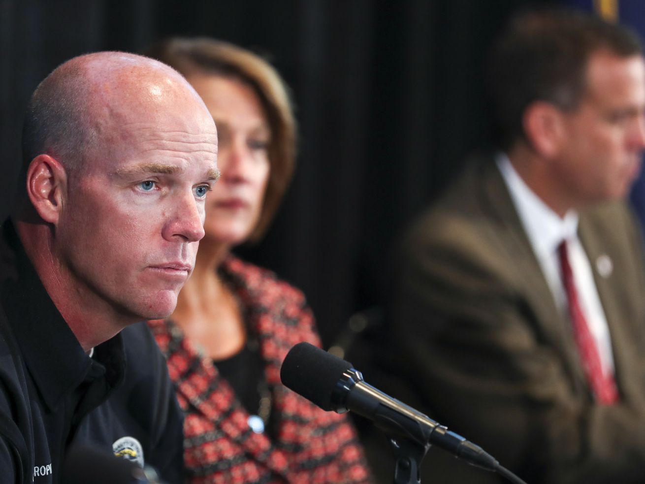 Former University of Utah Police Chief Dale Brophy,
left, is joined by U. President Ruth Watkins and Athletic Director
Mark Harlan during a press briefing on the fatal shooting of Lauren
McCluskey in Salt Lake City on Oct. 25, 2018.