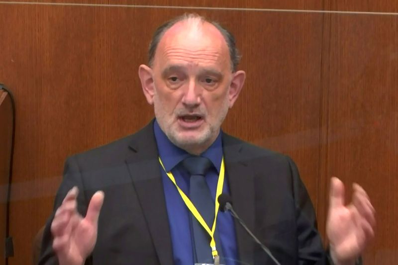 The former chief medical examiner of Maryland, Dr. David Fowler, answers questions during the thirteenth day of the trial of former Minneapolis police officer Derek Chauvin for second-degree murder, third-degree murder and second-degree manslaughter in the death of George Floyd in Minneapolis, Minnesota, U.S. April 14, 2021 in a still image from video.  Pool via REUTERS