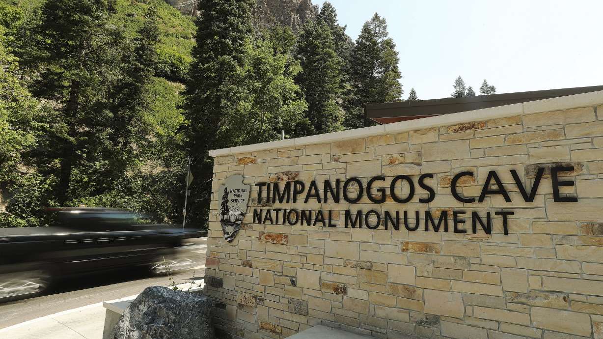 A motorists drives past the Timpanogos Cave National Monument sign in American Fork Canyon on Tuesday, July 21, 2020. Visits to all national parks in Utah this summer are drastically down with the exception of Timpanogos Cave.