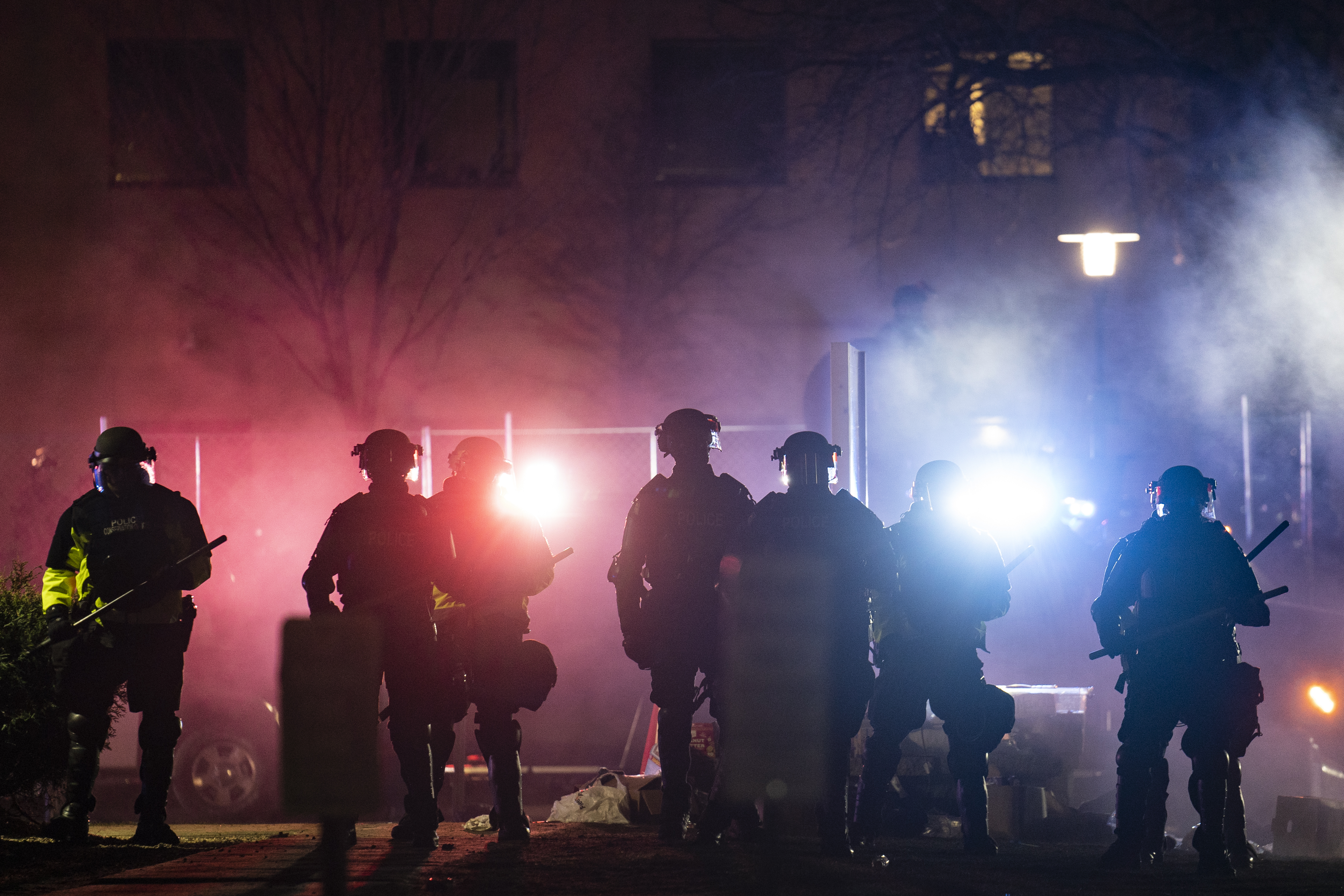 Law enforcement officers clear an area of demonstrators during a protest over Sunday's fatal shooting of Daunte Wright during a traffic stop, outside the Brooklyn Center Police Department on Wednesday, April 14, 2021, in Brooklyn Center, Minn. (AP Photo/John Minchillo) [Apr-15-2021]