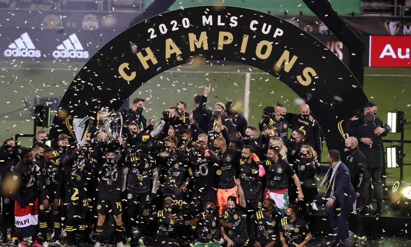 FILE PHOTO: Dec 12, 2020; Columbus, Ohio, USA; Columbus Crew defender Milton Valenzuela (19) hoists the MLS Cup championship trophy after defeating the Seattle Sounders in the 2020 MLS Cup Final at MAPFRE Stadium.  Mandatory Credit: Trevor Ruszkowski-USA TODAY Sports