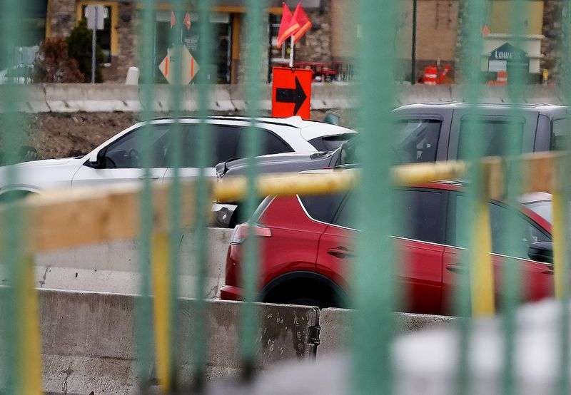 Traffic moves through the construction zone for the
Bangerter Highway interchange at 12600 South in Riverton on
Thursday, April 15, 2021. The Utah Department of Transportation
will work on 185 projects in 2021, with a value of $3.45 billion
over the life of the projects, many of which span multiple
years.