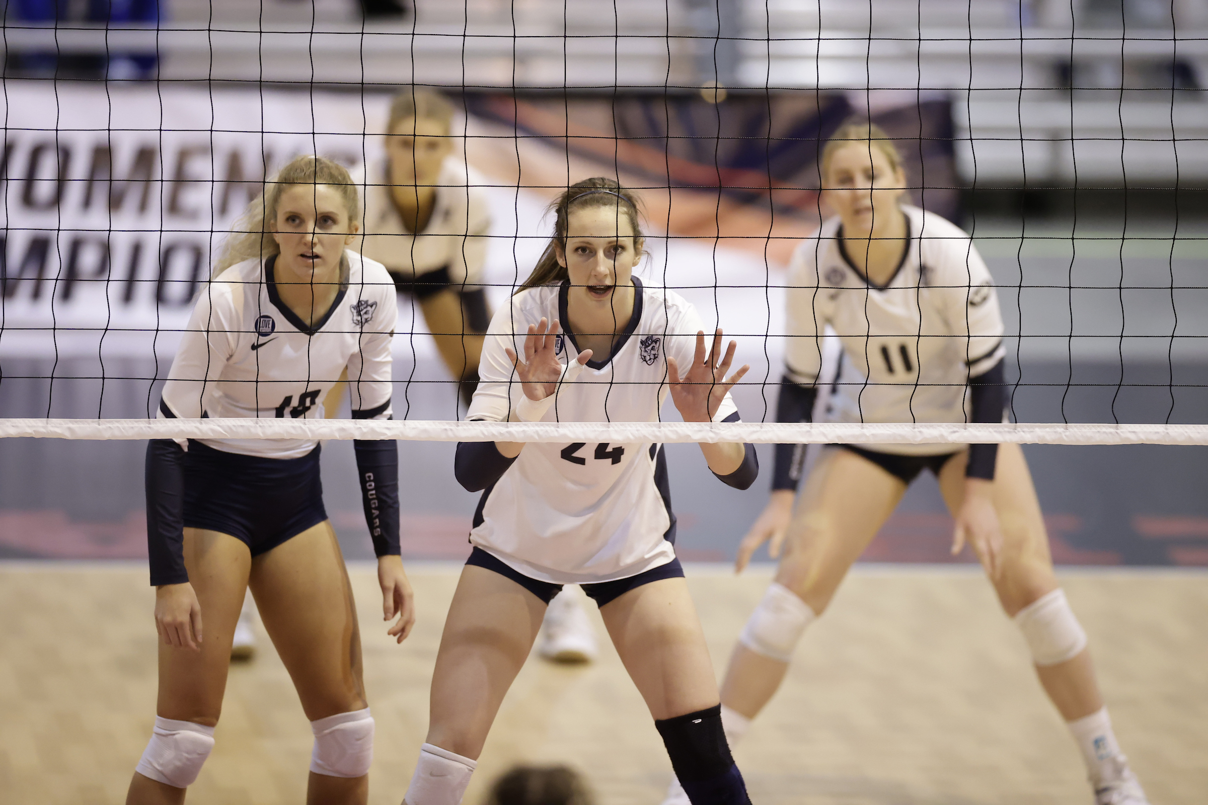 BYU's Kennedy Eschenberg (24) leads the front-row block during a second-round match of the 2020 NCAA women's volleyball tournament against UCLA, Thursday, April 15, 2021 in Omaha.
