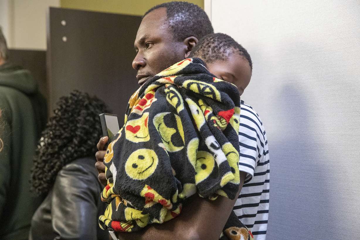 Family members await information about their loved ones who work at the FedEx facility in Indianapolis where a mass casualty shooting occurred late Thursday, on Friday, April 16, 2021.