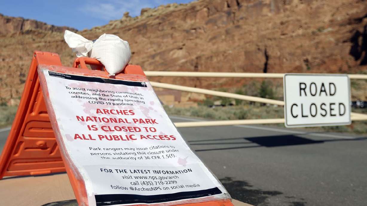 A sign alerts visitors that Arches National Park
outside of Moab is closed due to the coronavirus pandemic on April
19, 2020.