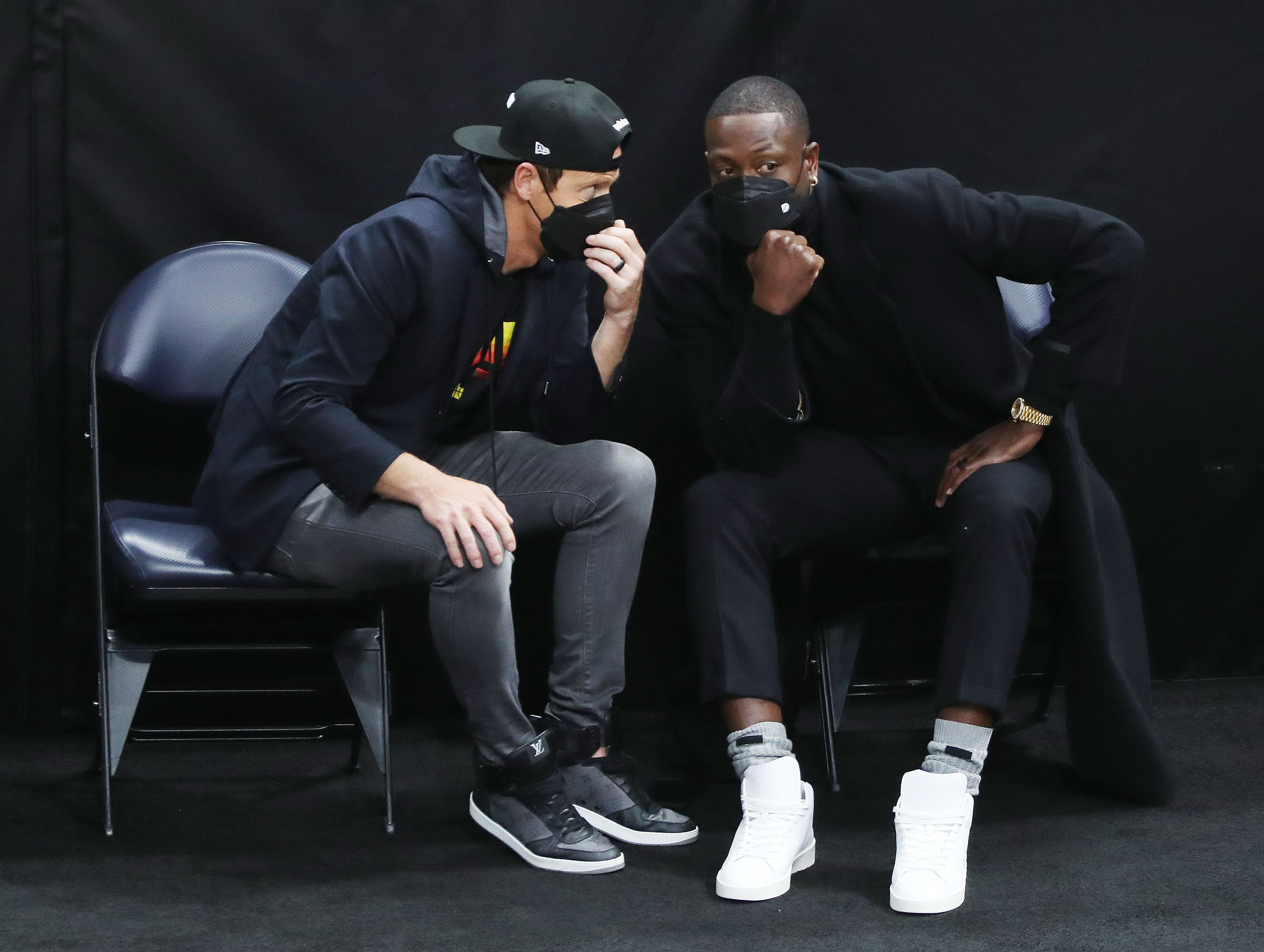Utah Jazz owner Ryan Smith, left, and Dwayne Wade, who bought a share of the team, talk during a game at the Vivint Arena in Salt Lake City on Friday, April 16, 2021.
