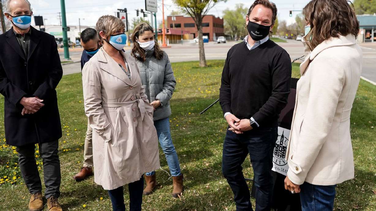 Salt Lake City Councilman Andrew Johnston, second from
right, chats with Mayor Erin Mendenhall and other City cCouncil
members after it was announced he has been hired as the city’s
director of homelessness policy and outreach during a press
conference at the corner of 800 West and North Temple in Salt Lake
City on Friday, April 16, 2021.
