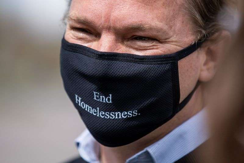 Salt Lake City Councilman Andrew Johnston chats with
Mayor Erin Mendenhall and other City Council members after it was
announced he has been hired as the city’s director of homelessness
policy and outreach during a press conference at the corner of 800
West and North Temple in Salt Lake City on Friday, April 16,
2021.