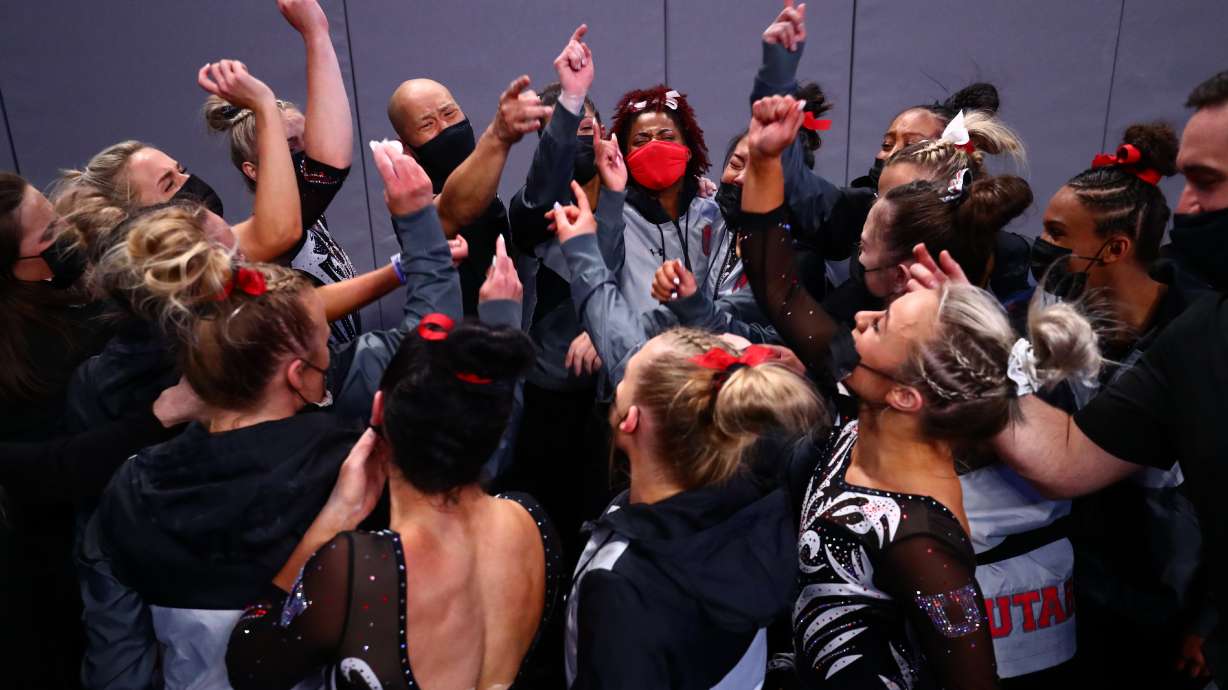 Head coach Tom Farden of the Utah Utes and Cammy Hall of the Utah Utes react to advancing to the national championship final during the Division I Women's Gymnastics Championship held at Dickies Arena on April 16, 2021 in Fort Worth, Texas. (Photo by C. Morgan Engel/NCAA Photos via Getty Images)