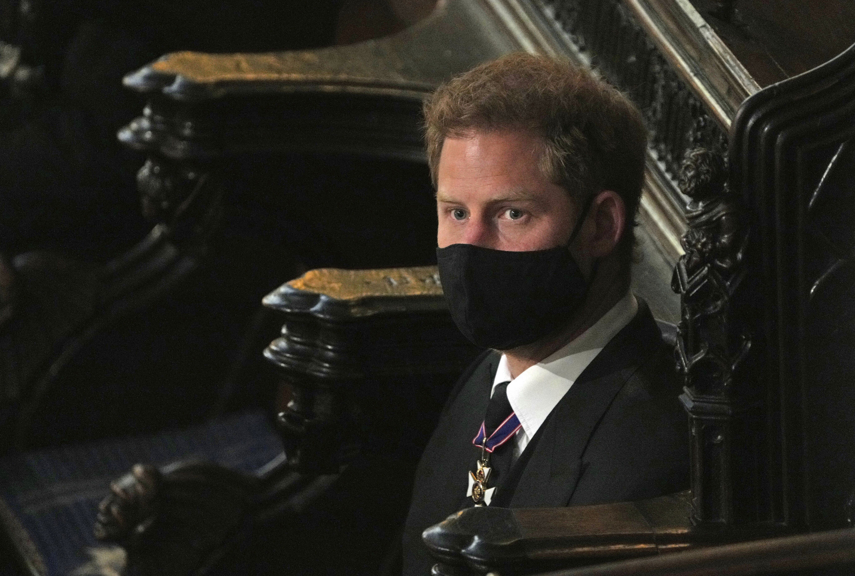 Prince Harry sits alone at St. George’s Chapel during the funeral for Prince Philip, at Windsor Castle, Windsor, England, Saturday April 17, 2021. Prince Philip died April 9 at the age of 99 after 73 years of marriage to Britain's Queen Elizabeth II. (Yui Mok/Pool via AP) [Apr-17-2021]