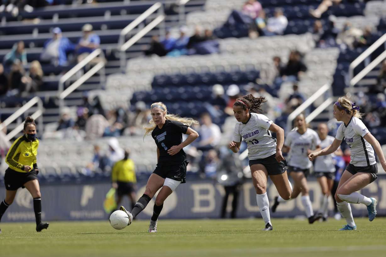 BYU's Mikayla Colohan passes the ball against Portland during the Cougars' regular-season finale, Saturday, April 17, 2021 in Provo.
