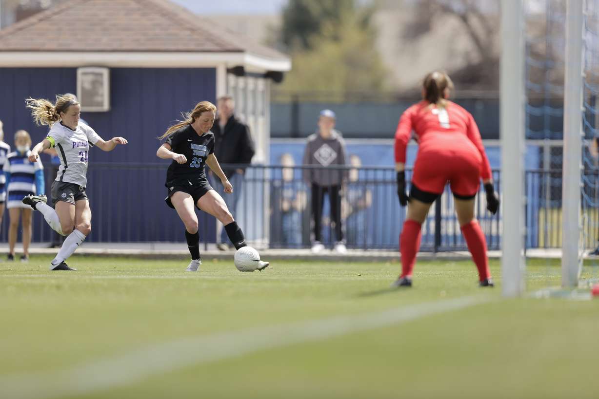 BYU's Rachel McCarthy dribbles toward goal against Portland during the Cougars' regular-season finale, Saturday, April 17, 2021 in Provo.